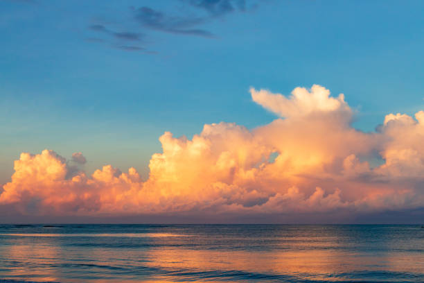 istock Beautiful cloudscape over the sea at sunset 1464412743