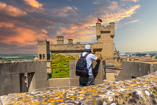A tourist visiting the Royal Palace in the medieval town of Olite in southern Navarra Spain