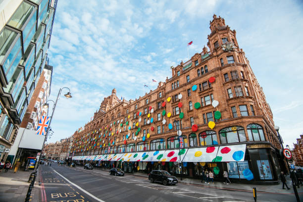 London, UK - February 05, 2023: Famous London Department store Harrods in Knightsbridge is decorated in colourful dots by Japanese designer Yayoi Kusama. Artistic project where polka dotted motifs are dominant, she made with Louis Vuitton brand is called Infinite possibility.