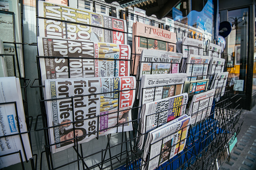 London, UK - February 05, 2023: Newspaper stand on street of London on Sunday morning as the famous 10k charity run closed the streets of London. More than thousand people took part in the Cancer Research Charity run this year.