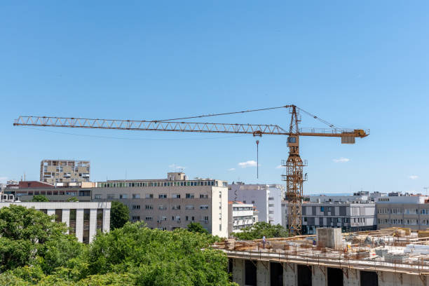 istock Large crane at construction site in city. 1464414884