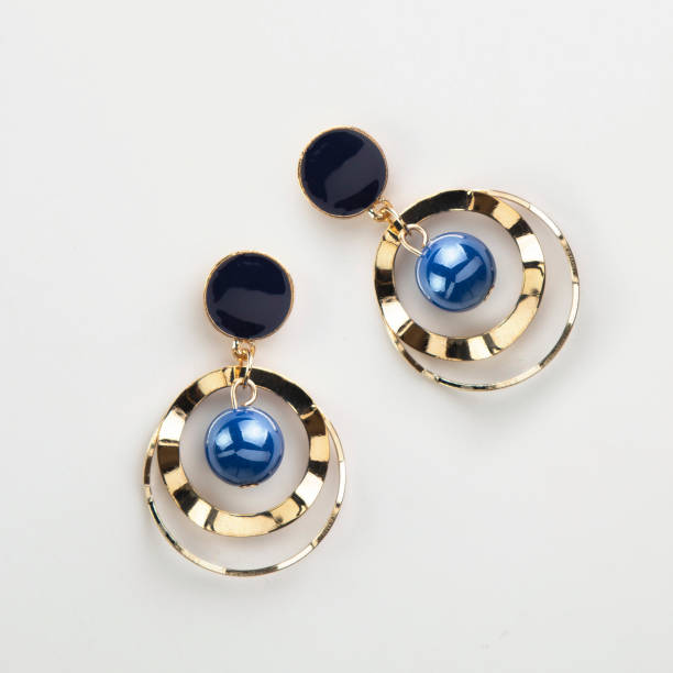 istock Golden round earrings with blue beads in them 1464415581