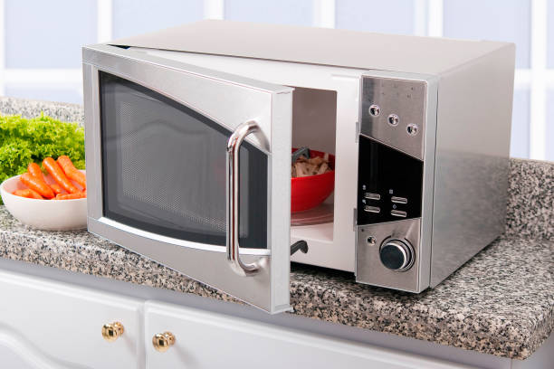 istock Microwave oven; photo in kitchen environment. 1464416027