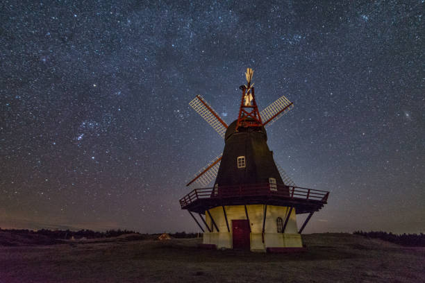 istock Windmill and a starry sky in the background. 1464416603