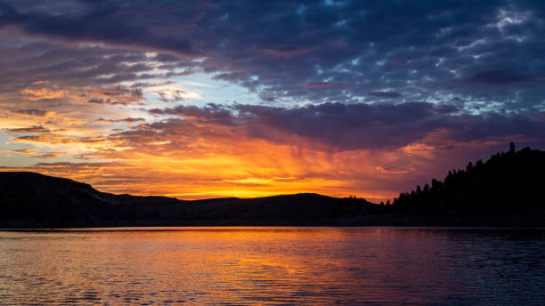 istock Colorful sunrise over mountain lake 1464417468