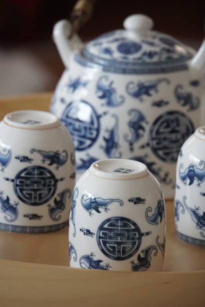 istock Antique ceramic white teapot and cups with blue patterns 1464418539
