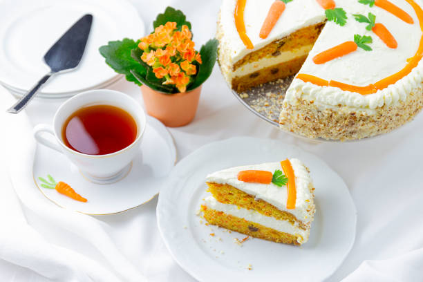 istock Closeup of carrot cake on a white plate with a fork 1464419080