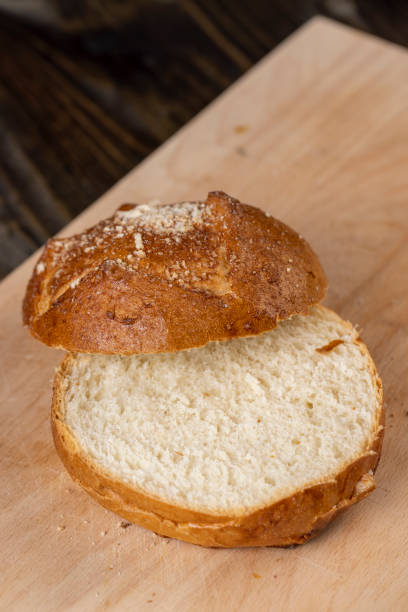 istock Wheat bun with large pieces of processed cheese inside 1464419864