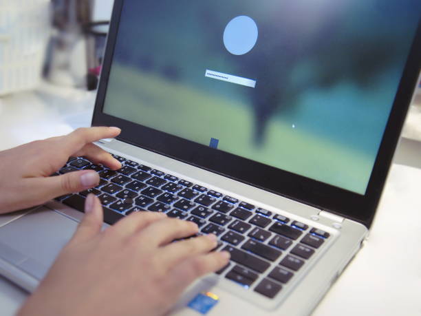istock Female hands on a laptop keyboard, working at a table, close-up. 1464423138