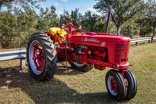 Fort Meade, FL - February 22, 2022: High perspective front corner view of a 1942 International Harvester McCormick Farmall Model H Tractor at a local tractor show.