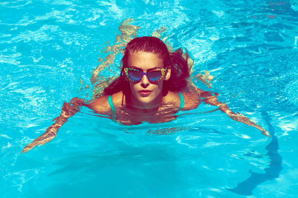 istock young  woman swim in  pool 1464424086