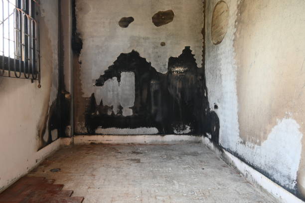 istock burn interior house with window and cement wall, old scary home 1464424325