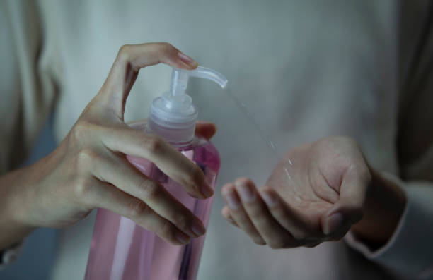 istock Close up Hand applying alcohol gel 1464426338