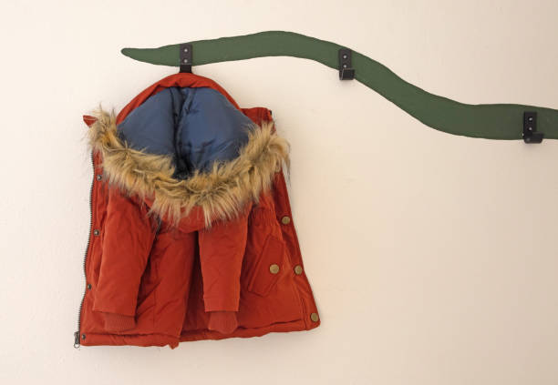 istock Winterjacket for a baby girl on a creative coathanger 1464426559