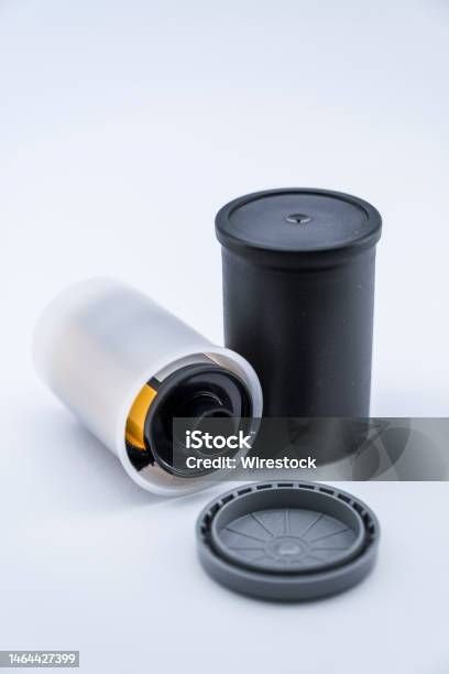 A Vertical Shot Of Film Canisters Stock Photo - Download Image Now - Analog, Backgrounds, Black Color