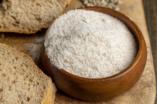 Wheat flour with bran for cooking bread, unrefined organic flour with bran from wheat grain