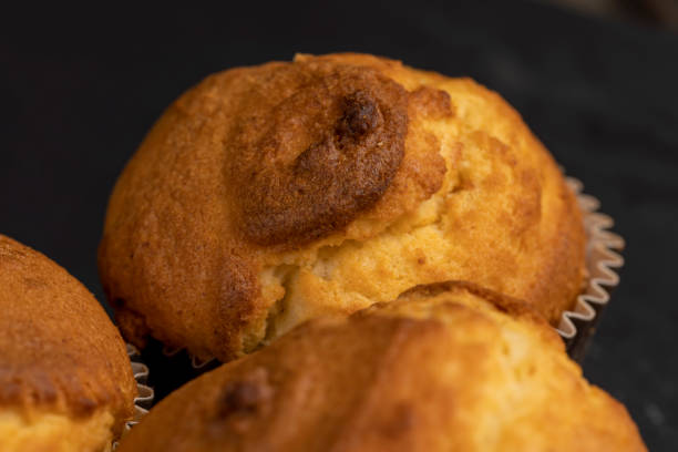 istock Soft and fresh fragrant wheat cupcake on a black stone 1464435709