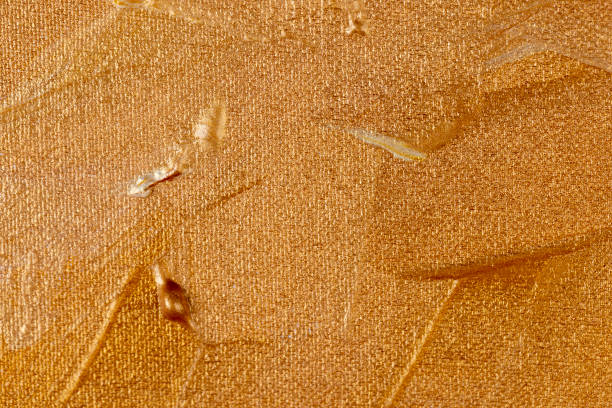 istock Abstract background painted with gold acrylic paints 1464435979