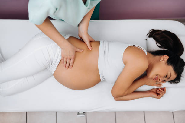 istock Pregnant woman at relaxing massage 1464441676