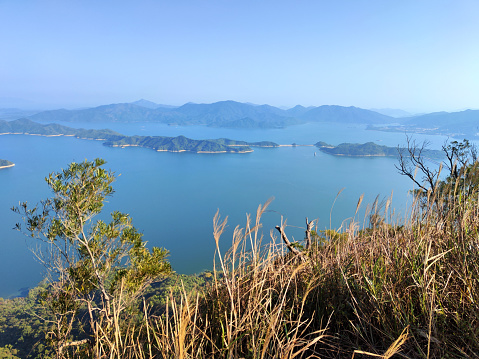 Panoramic view of the Tolo Harbour from Pat Sin Leng, a mountain range in the northeast New Territories of Hong Kong, located within the Pat Sin Leng Country Park. The name means \