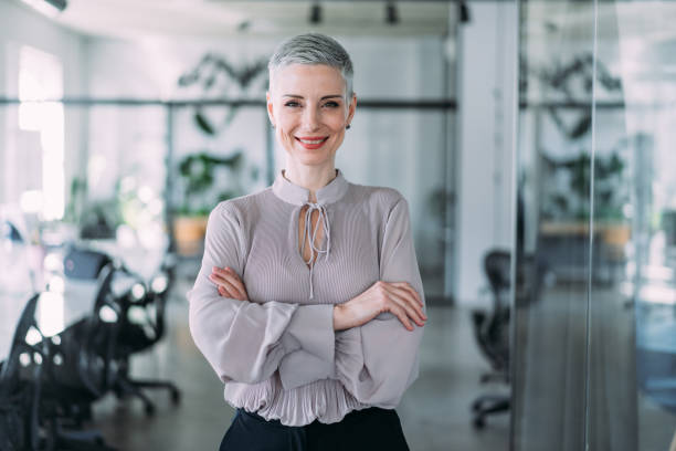istock Confident businesswoman in modern office. 1464444505
