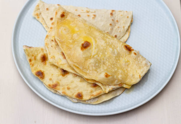 istock Pita cakes with butter on a plate. View from above. 1464449847