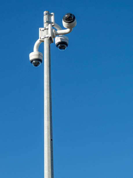 istock vertical pole with 3 video surveillance cameras on top under blue eu background 1464449913