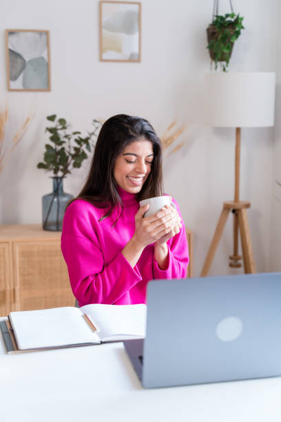 istock Smiling woman with cup of coffee 1464452998