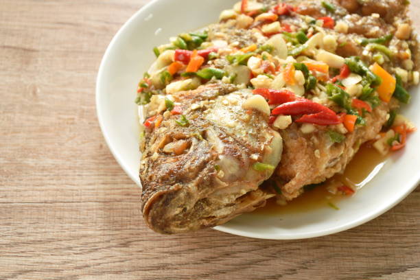 istock fried mango fish dressing spicy sauce herb sauce 1464456369