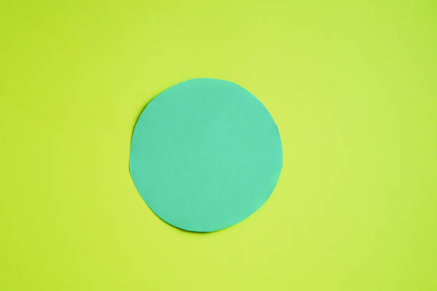 istock Two circles - green and blue on a yellow background. A space to create ideas. 1464456641