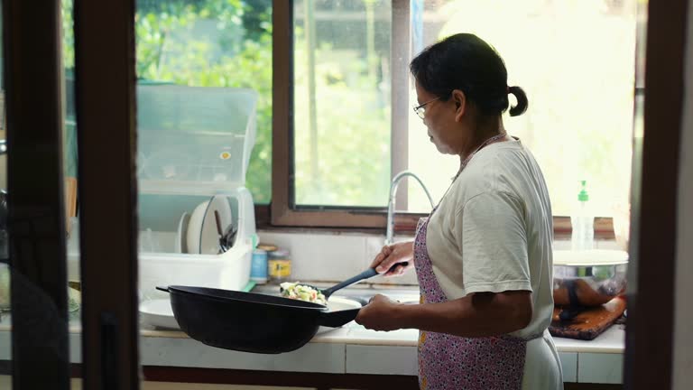 Street food kitchen with senior chef