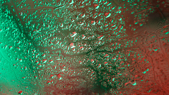 Natural water drops background. Close-up of misted glass with large water drops.