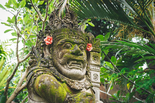 Traditional sculpture made of stone seen in the Bali island, Indonesia.