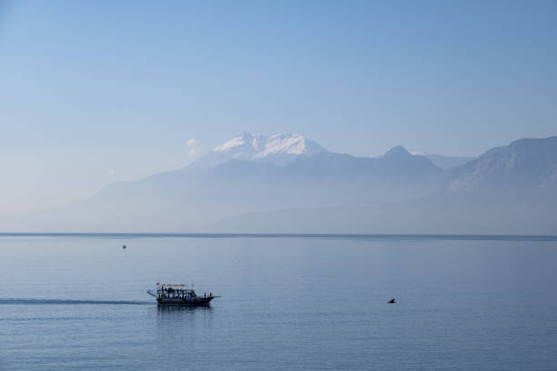 istock Mediterranean landscape cruise boat and mountain view 1464461034