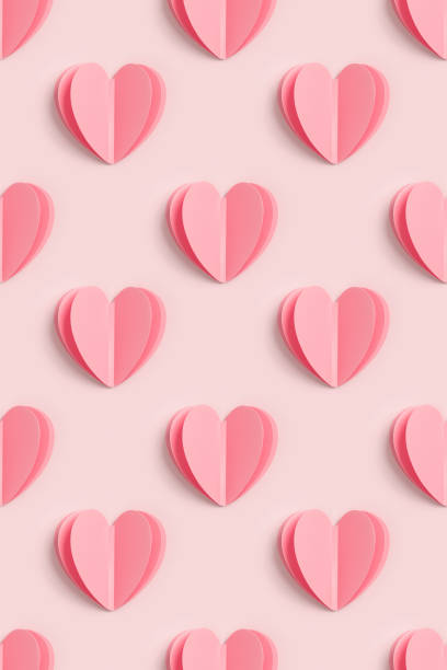 istock Pink hearts on pink colored background, minimal trend seamless pattern, pastel monochrome color print as valentines day or wedding background. Paper cut hearts, romantic holiday concept, above 1464462433