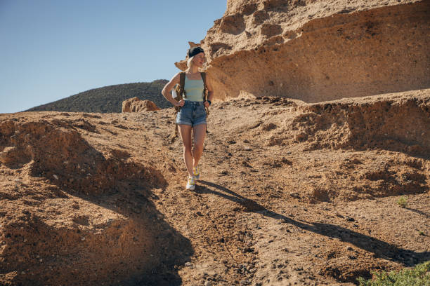 istock Woman with backpack in nature 1464462688