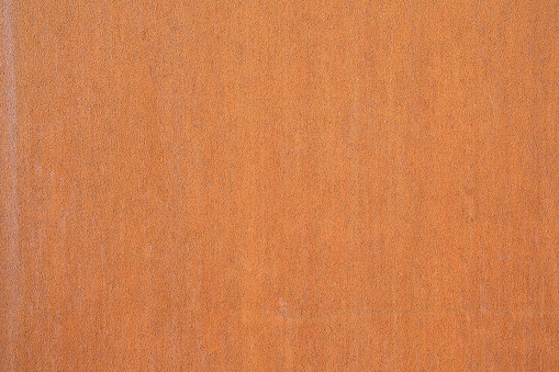 Rusty metal plate front view used in construction industry - Corten steel background