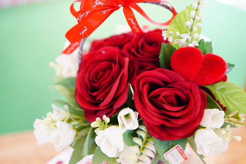 Valentines day red roses with decor on color table
