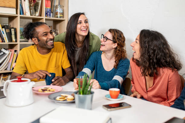istock Friends studing together in a cafeteria, people have some snack for a break, multiracial group having fun indoors 1464482738
