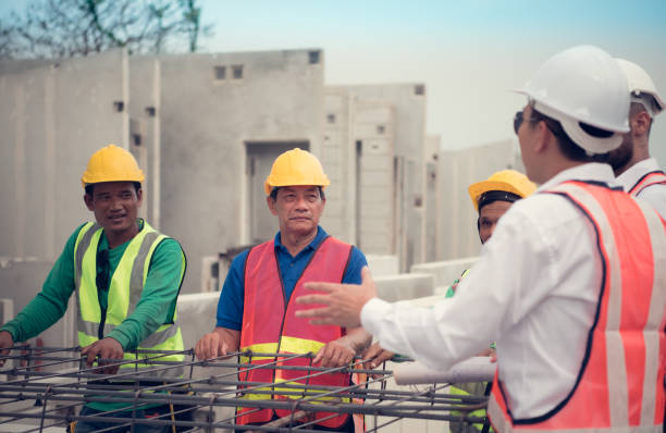 istock Construction engineer and construction foreman Monitor the progress and supervise important construction works on the construction site. 1464484417