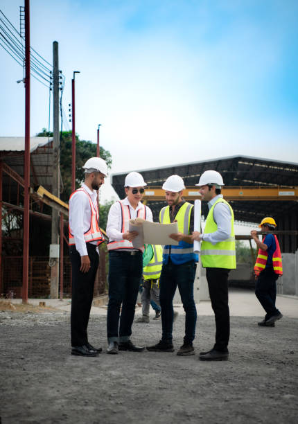 istock Architects a visit to the construction site. Ready to talk the progress of construction projects in the construction area with construction supervision engineers. 1464484525