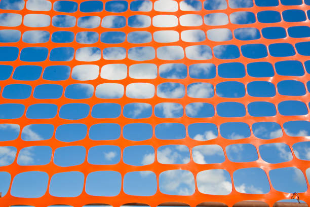 istock Plastic safety grid in construction site areas for the protection of construction activities 1464486285