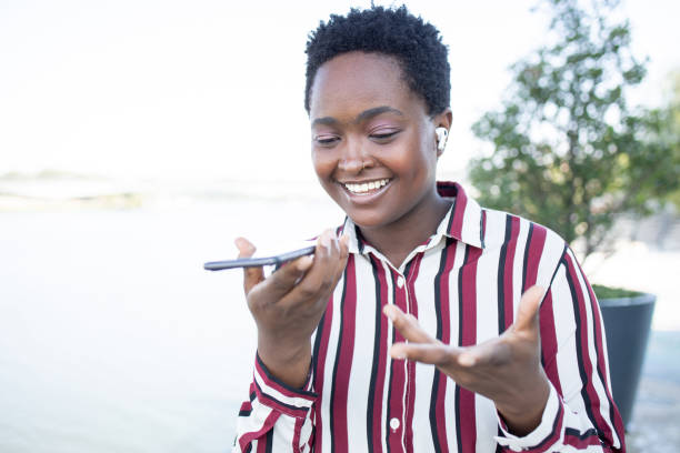 istock Happy young woman using phone 1464489920