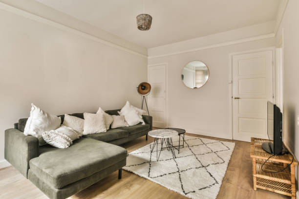 istock a living room with a gray couch and a rug 1464495749