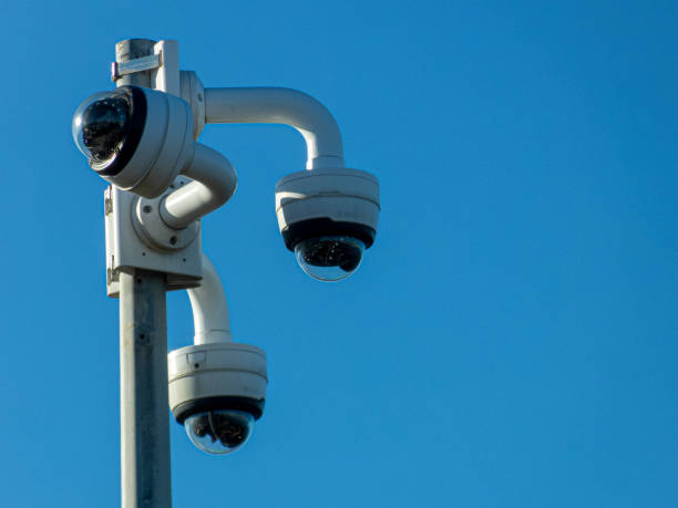 istock vertical pole with 3 video surveillance cameras on top under blue eu background 1464496428