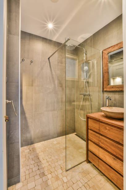istock a bathroom with a shower and a sink in it 1464496474