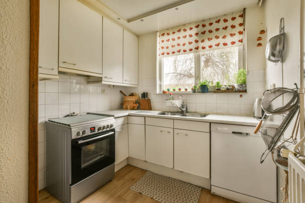 istock a kitchen with white cabinets and a stove and sink 1464496532