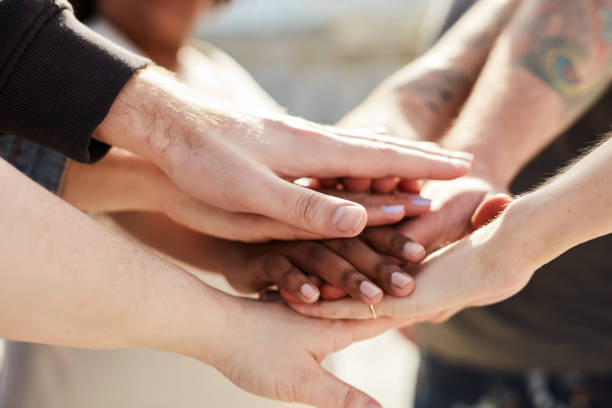 istock Teamwork, support and community with hands fo people for goals, mission and happiness. Collaboration, solidarity and trust with friends in and stack in outdoor for partnership, target and connection 1464496818