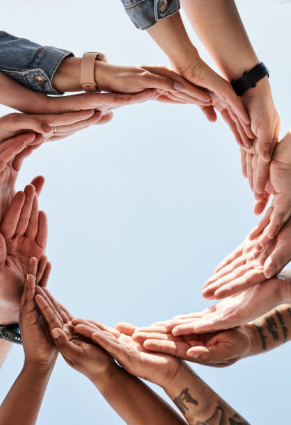 istock Community, circle or hands with global support, trust or diversity together as a group in solidarity. Collaboration, team work or people in faith, hope or partnership with sky mockup space outdoors 1464496994
