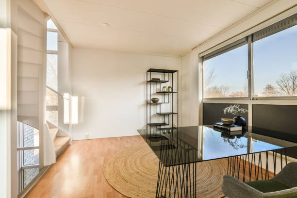 istock a living room with a glass table and a window 1464499420